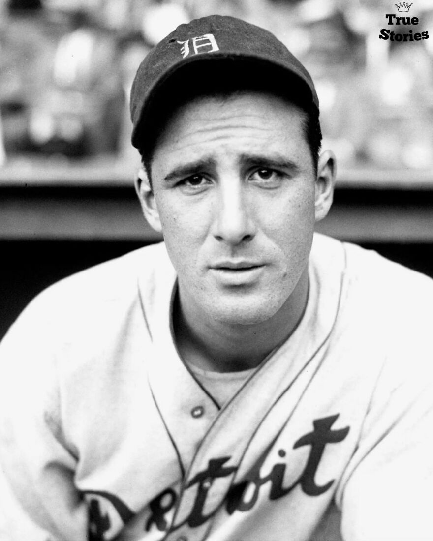 Black and white portrait of an important American personality in a Detroit baseball uniform and cap, focused and serious expression.