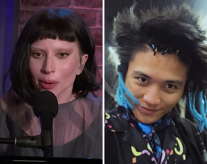 Lady Gaga speaking into a microphone during a performance, alongside a man with blue dreadlocks and colorful attire.