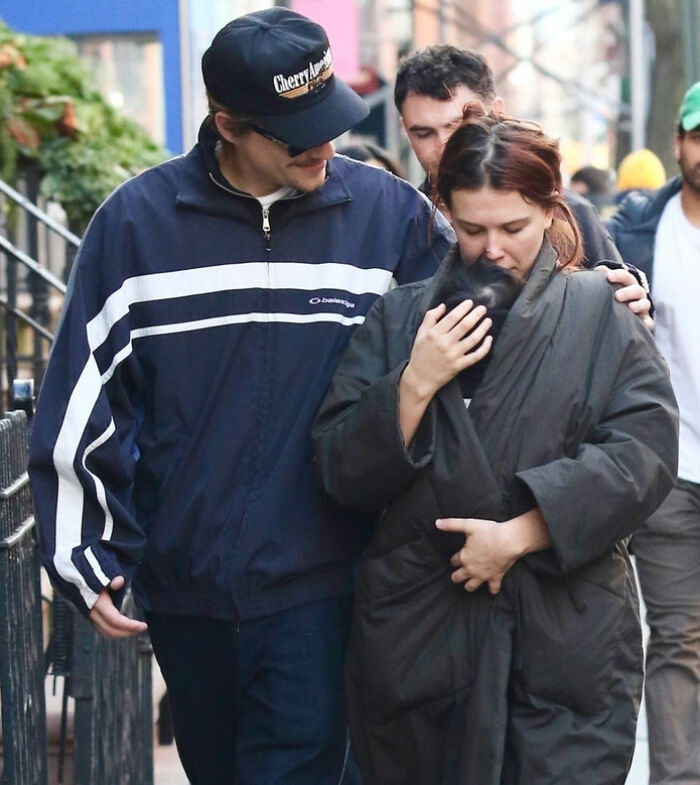 Millie Bobby Brown walking with partner outdoors, embracing her newborn daughter amid viral theory after new photos surfaced. Millie Bobby Brown walking with partner outdoors, embracing her newborn daughter amid viral theory after new photos surfaced.