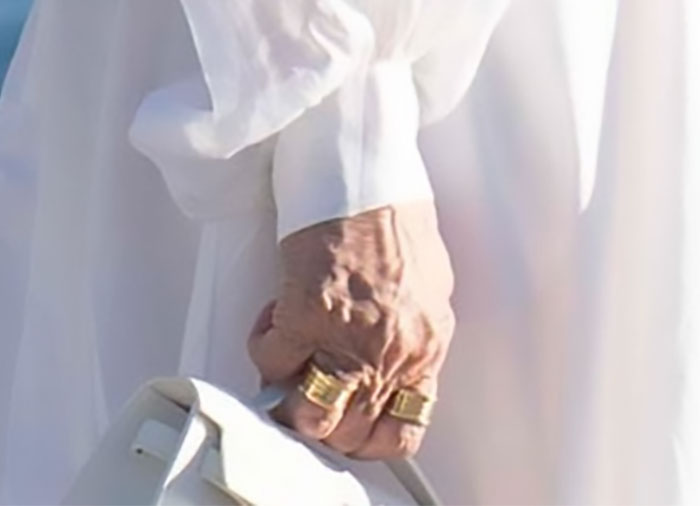 Close-up of Kris Jenner’s hand without gloves, showcasing her rings and natural skin after viral $100k facelift. Close-up of Kris Jenner’s hand without gloves, showcasing her rings and natural skin after viral $100k facelift.