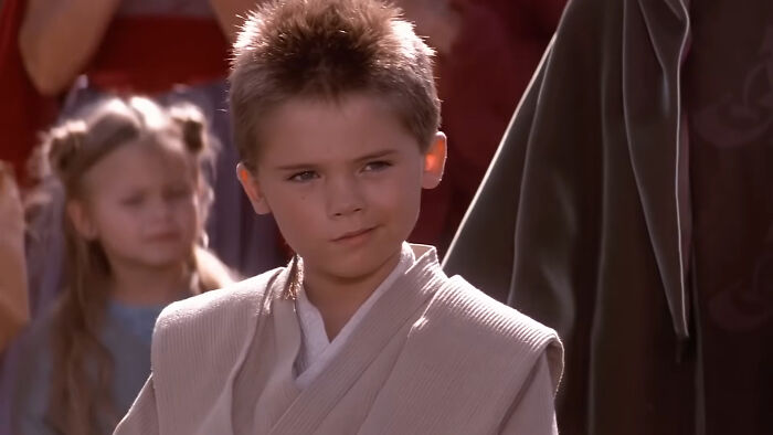 Young boy dressed in Jedi robes from a once-famous regular job scene in a Star Wars film.