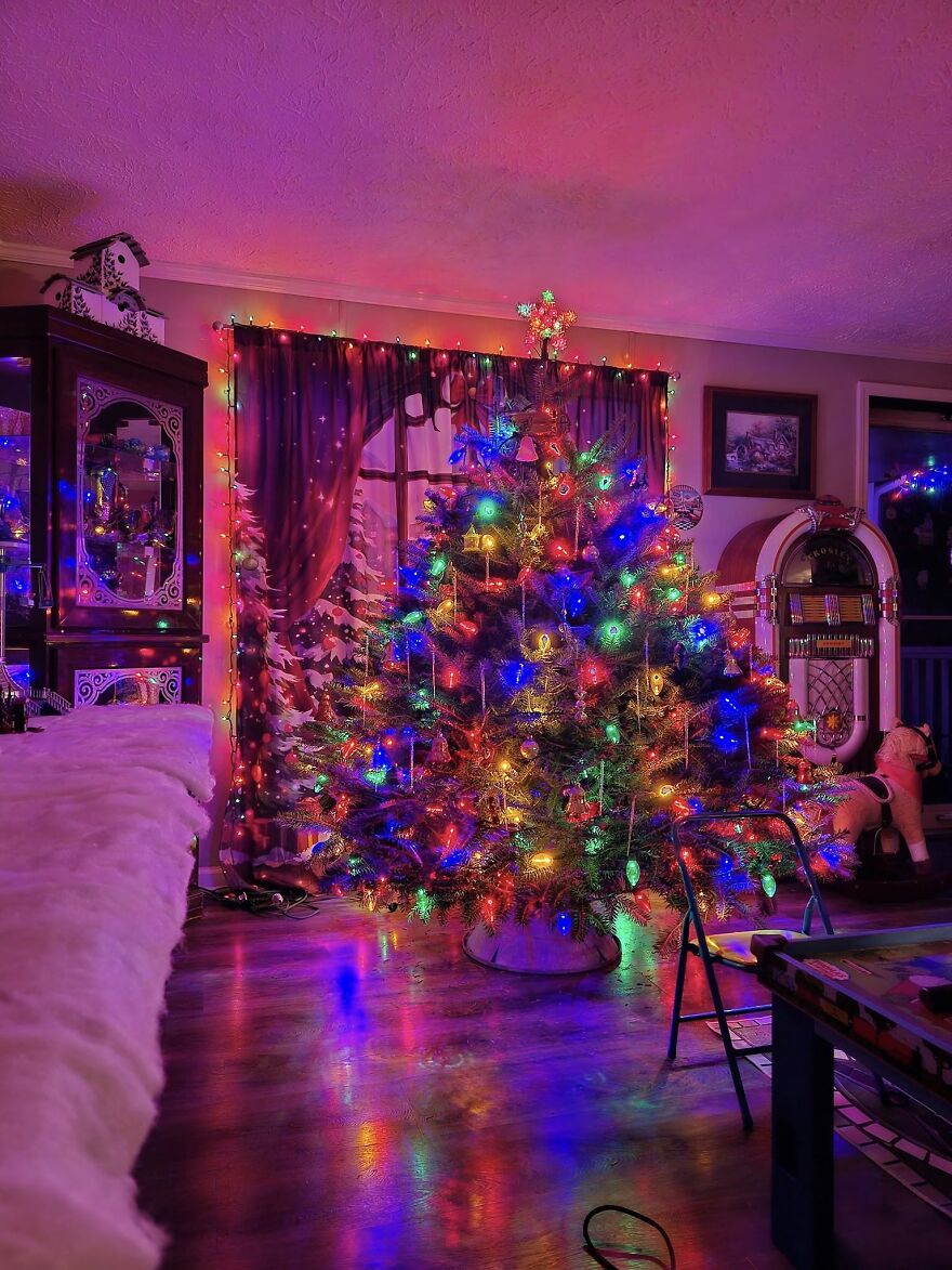 Vintage Christmas decorations featuring a colorful lit tree and retro holiday décor in a cozy living room setting.