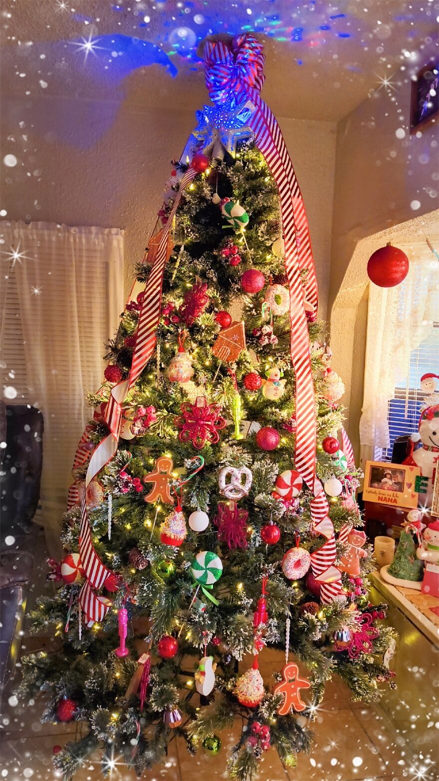 Christmas tree decorated with vintage nostalgic ornaments including gingerbread men, candy canes, and striped ribbons.