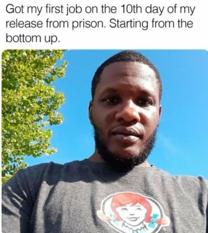 Man wearing a gray shirt with a Wendy’s logo, sharing a wholesome story about getting a job after prison.