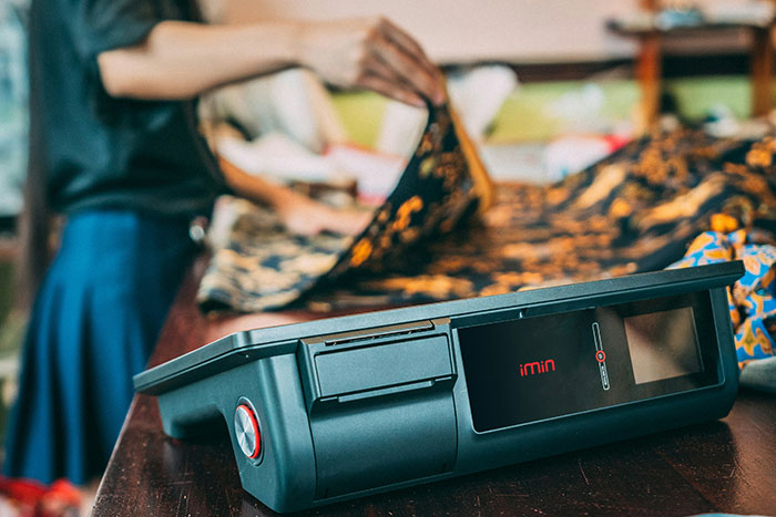 Older man and woman shopping at Goodwill store, with the woman stopping the man during their interaction. Older man and woman shopping at Goodwill store, with the woman stopping the man during their interaction.