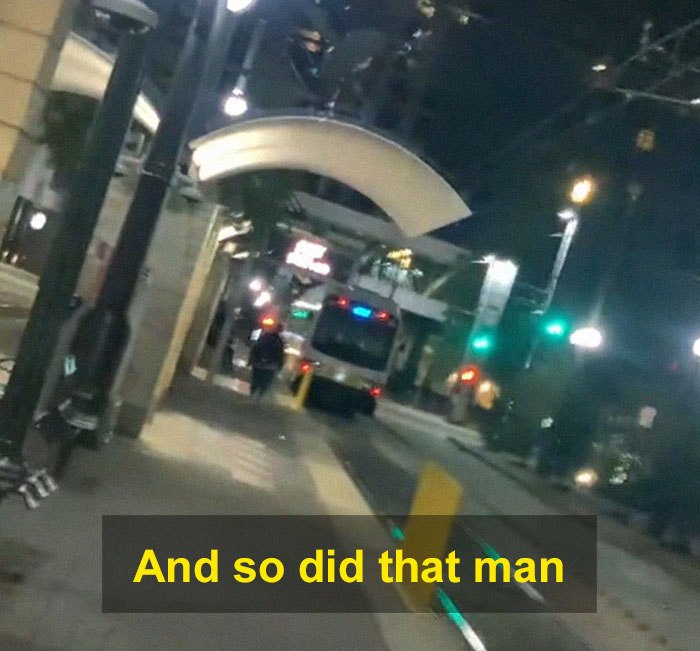 Nighttime street scene with a woman scaring off men stalkers near a tram station using a period pad. Nighttime street scene with a woman scaring off men stalkers near a tram station using a period pad.