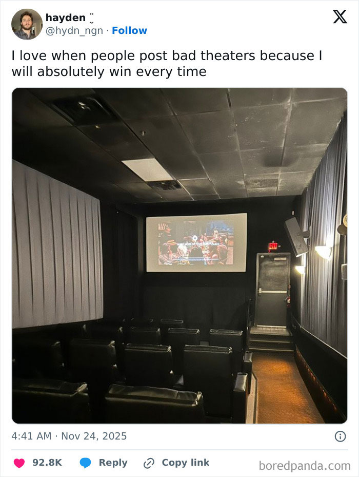 Small, dark movie theater room with limited seating, dim lighting, and a screen showing a blurry image, illustrating worst movie theaters.