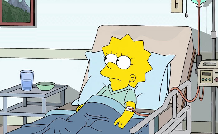 Lisa Simpson lying in a hospital bed with IV and monitor, looking concerned, The Simpsons 2026 predictions