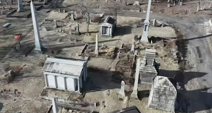 Aerial view of a chilling old cemetery near a house linked to a skull found in a man's car, prompting a horrifying discovery.