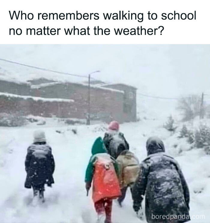 Kids walking to school in heavy snow, showing nostalgic moments that make you feel old as heck and remember the past.