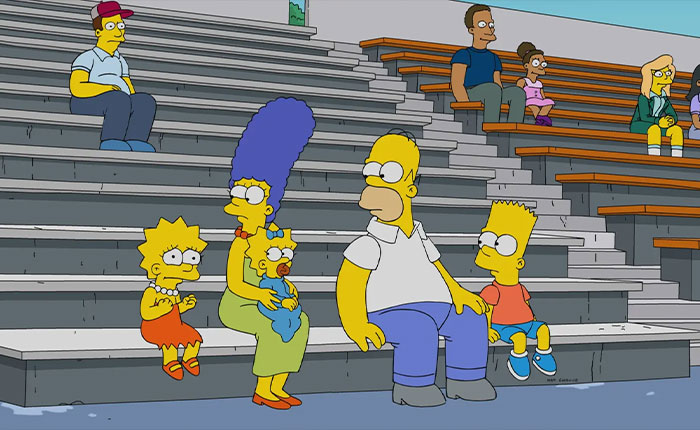 The Simpsons family sitting on stadium bleachers, Marge holding Maggie, Homer looks at Bart while Lisa fidgets The Simpsons family sitting on stadium bleachers, Marge holding Maggie, Homer looks at Bart while Lisa fidgets