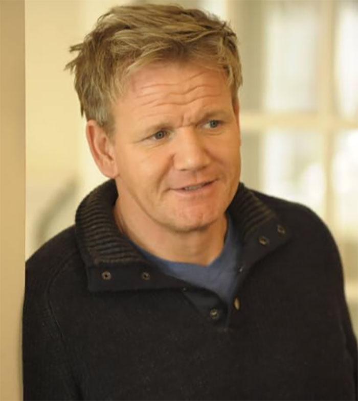 Man with tousled hair wearing a dark sweater, representing movie set workers sharing stories about diva stars.