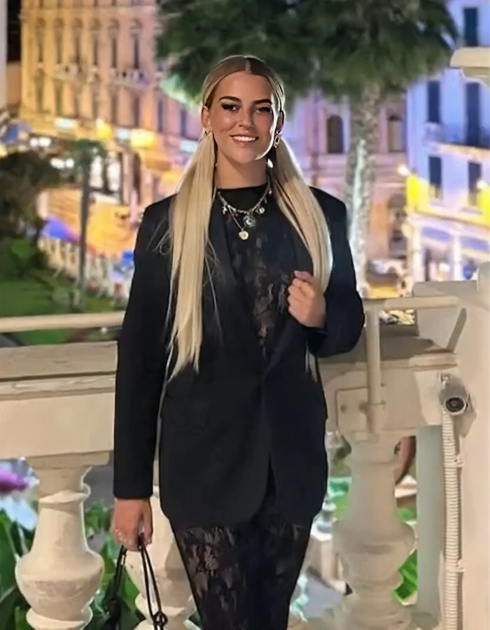 Young woman with long blonde hair wearing a black outfit, representing the fate of waitress in Swiss ski resort fire case. Young woman with long blonde hair wearing a black outfit, representing the fate of waitress in Swiss ski resort fire case.