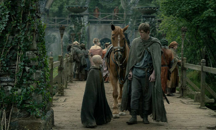 Peter Claffey's height mocked by child star Dexter Sol Ansell during a medieval-style outdoor interview scene.