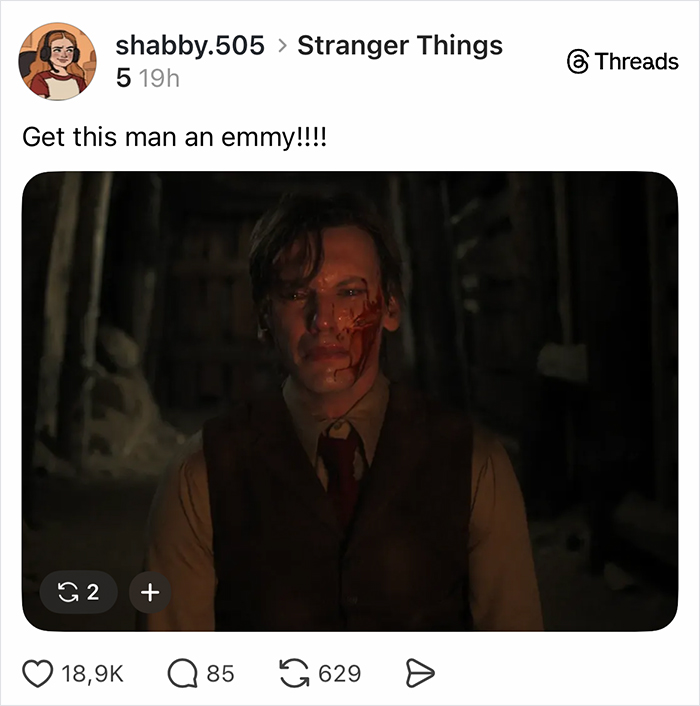Man with blood on face in dark setting from Stranger Things finale, highlighting fans' reactions to the show's ending.