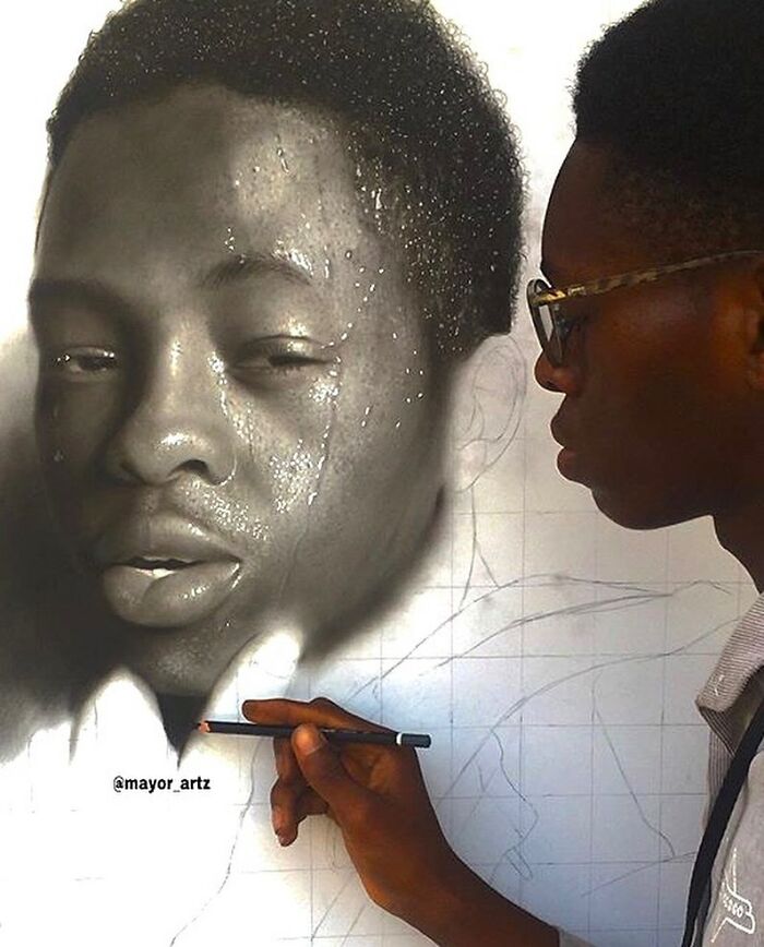Artist creating a hyperrealistic portrait using pencil and blending techniques in a behind-the-scenes drawing process.