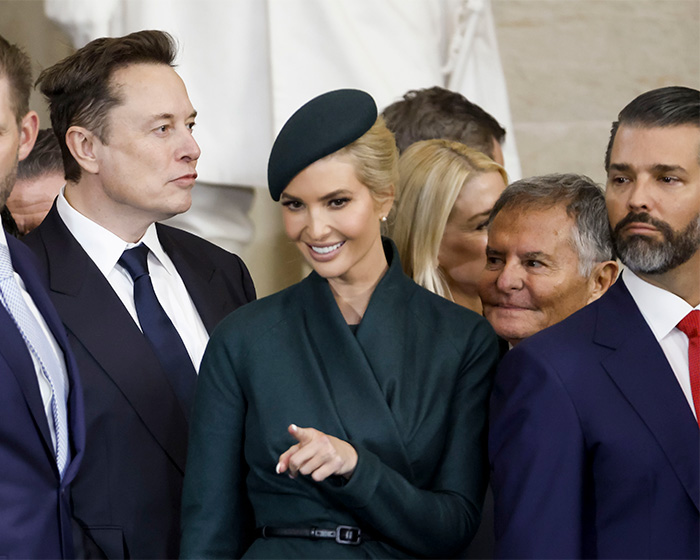 Group of people at a formal event, with a woman in a green outfit and a man in a dark suit, related to Epstein victim claims. Group of people at a formal event, with a woman in a green outfit and a man in a dark suit, related to Epstein victim claims.