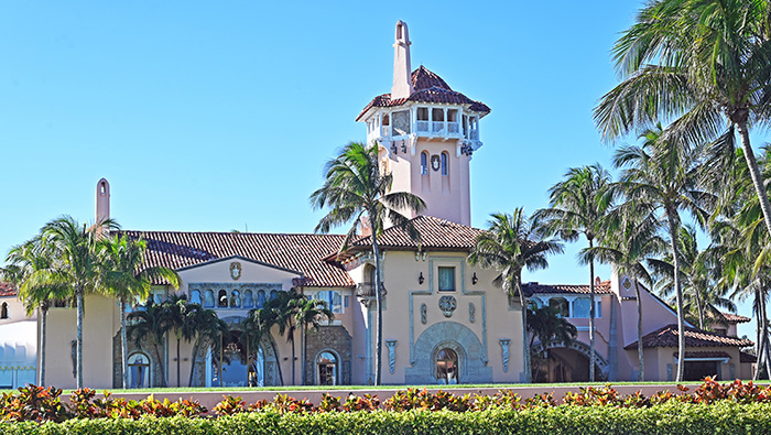 Mar-a-Lago estate exterior with palm trees under clear sky related to Epstein victim Trump claims in new files. Mar-a-Lago estate exterior with palm trees under clear sky related to Epstein victim Trump claims in new files.
