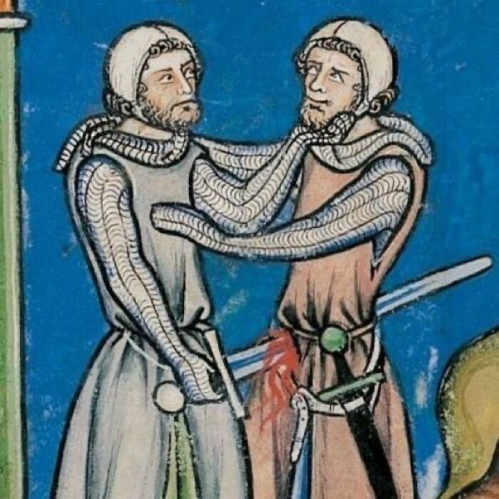Two medieval knights in chainmail entwining each other's necks, a humorous scene for meme captions and punchlines.