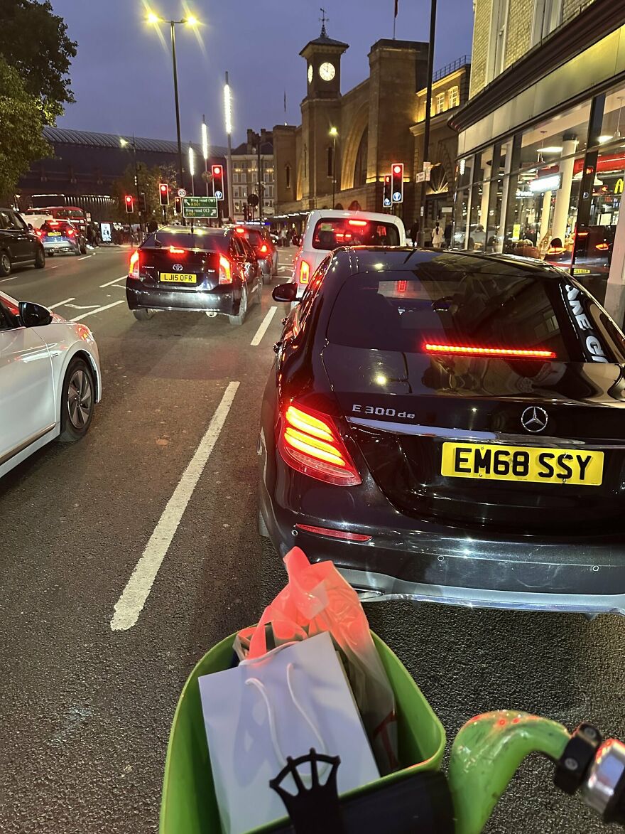 City traffic congestion at night with cars stopped at red lights, illustrating worst traffic in major cities worldwide.