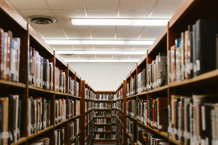 Library aisles filled with books, representing people so smart it was borderline creepy knowledge and intelligence.