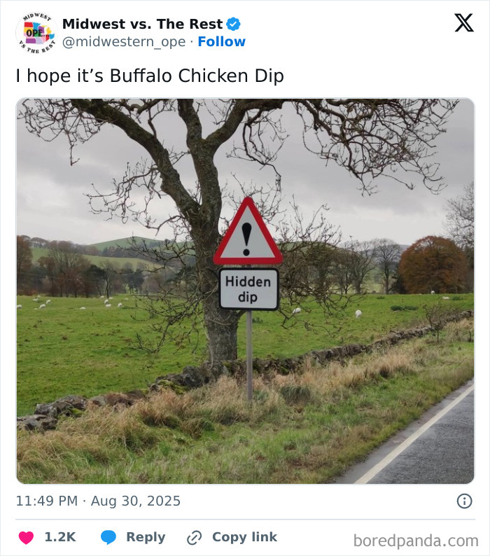 Road sign warning of a hidden dip on a rural roadside with trees and fields, illustrating Midwest life memes.