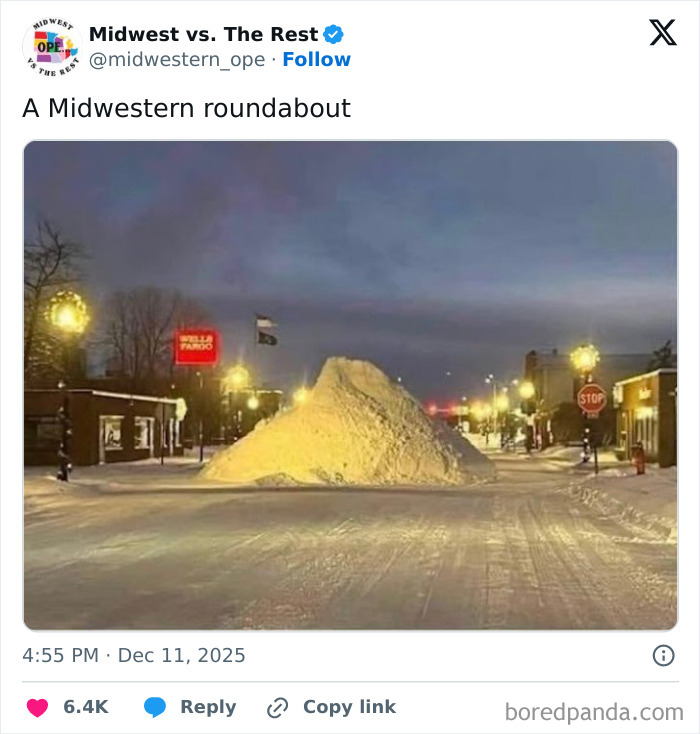 Large snow pile blocks a Midwest street, illustrating spot-on memes about Midwest life and snowy roundabouts.