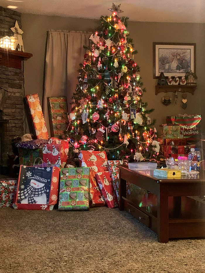 Christmas tree surrounded by numerous wrapped presents highlighting daughter's large gift haul for Christmas. Christmas tree surrounded by numerous wrapped presents highlighting daughter's large gift haul for Christmas.