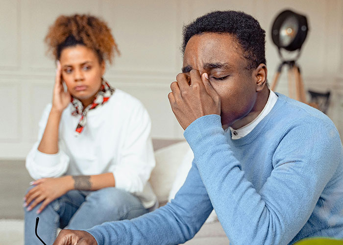 Husband throwing a full-blown tantrum while wife looks frustrated and refuses to follow his demands at home. Husband throwing a full-blown tantrum while wife looks frustrated and refuses to follow his demands at home.