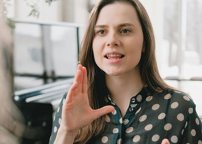 Woman expressing frustration while discussing skipping birthday party her sister organized due to ex being invited. Woman expressing frustration while discussing skipping birthday party her sister organized due to ex being invited.