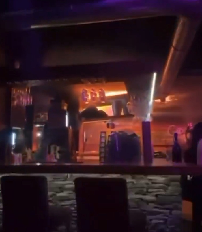Interior view of a ski resort bar with dim lighting, highlighting the setting before the explosion incident. Interior view of a ski resort bar with dim lighting, highlighting the setting before the explosion incident.
