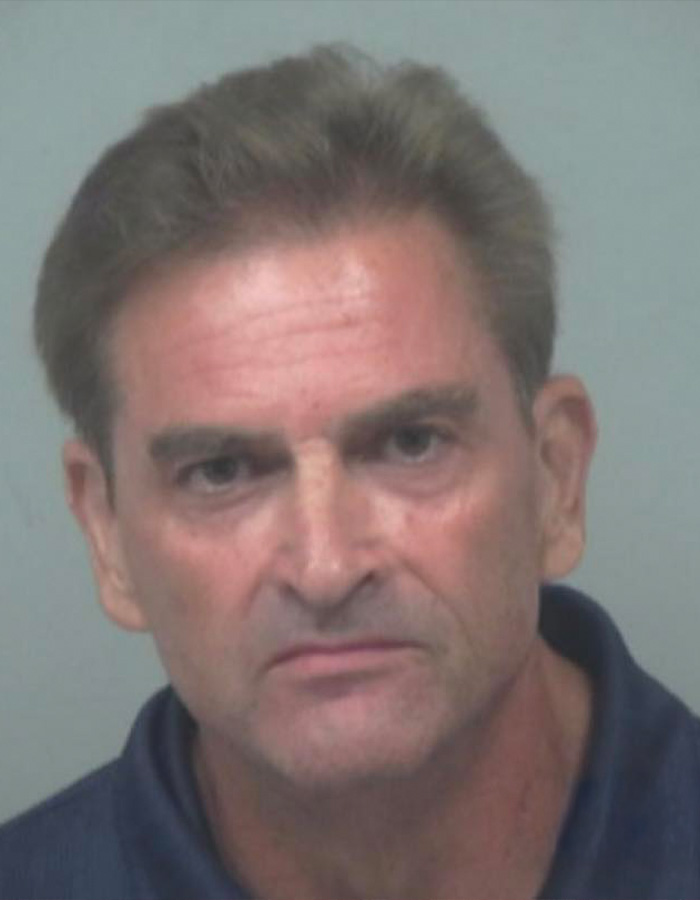 Mugshot of a man involved in a viral public meltdown, known as the male version of Karen after racist incident.