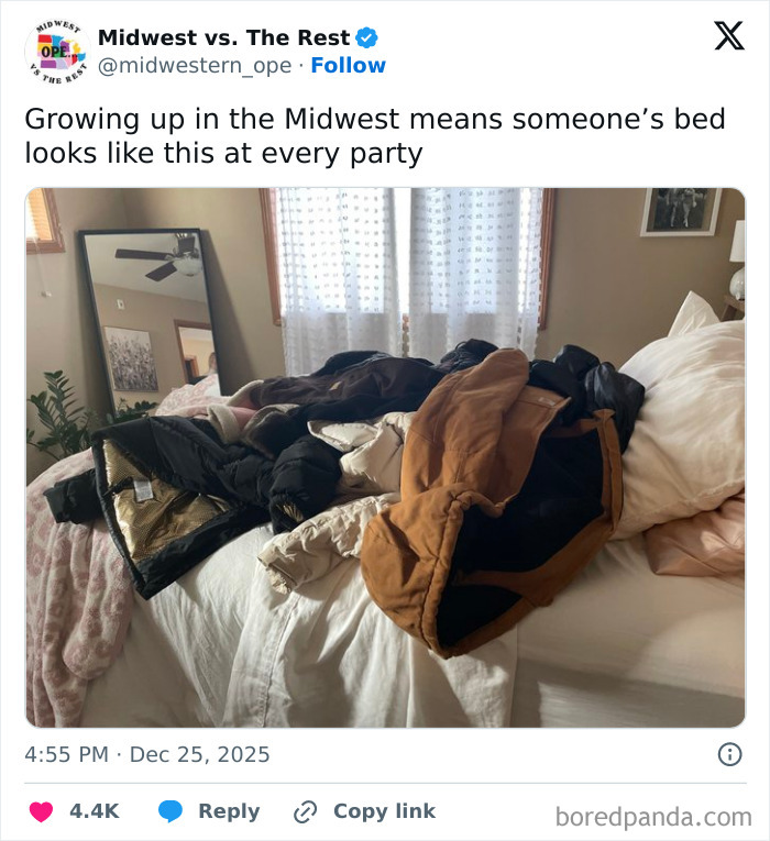 Pile of winter coats on a bed in a cozy room, illustrating a spot-on Midwest life meme about cold weather and gatherings.