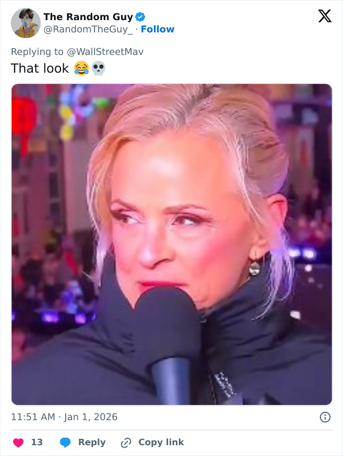 Amy Sedaris speaking into a microphone during CNN's New Year's Eve broadcast, with a blurred festive background. Amy Sedaris speaking into a microphone during CNN's New Year's Eve broadcast, with a blurred festive background.