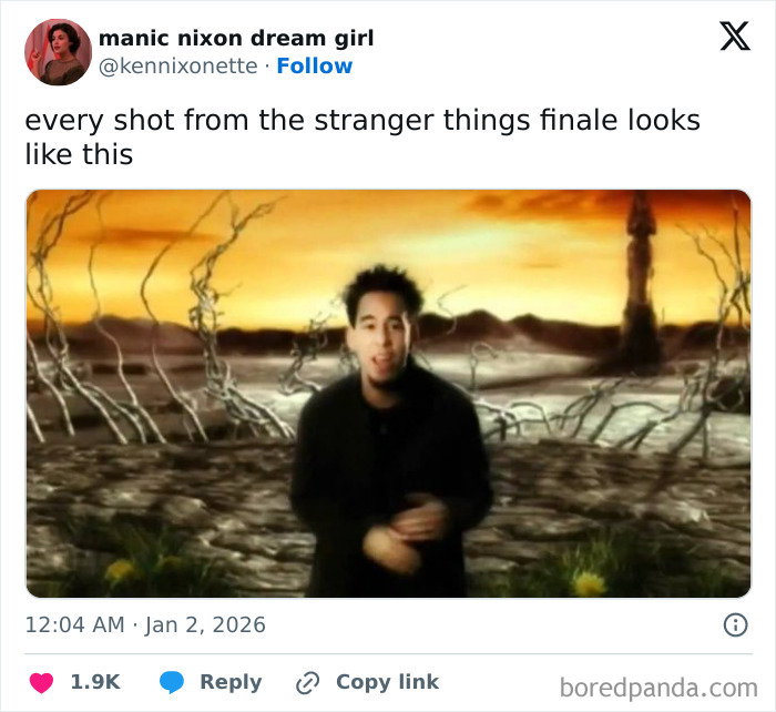A man standing in a barren, surreal landscape with twisted branches, referencing Stranger Things stupidest ending fans discuss.