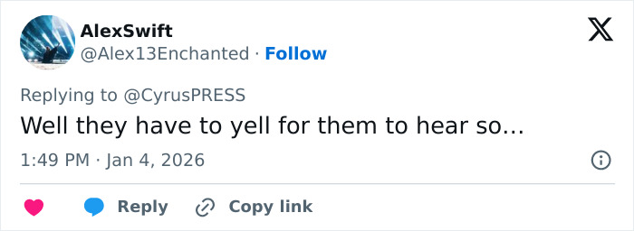 Tweet reply on social media discussing Miley Cyrus pushing back at photographers during tense red carpet encounter. Tweet reply on social media discussing Miley Cyrus pushing back at photographers during tense red carpet encounter.