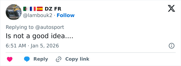 Pierre Gasly in racing gear with helmet, replying to backlash over a controversial Michael Schumacher tribute online.