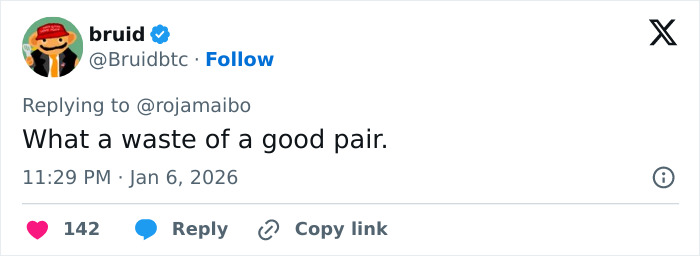 Screenshot of a social media reply showing a man trolling a woman after her viral breast reduction post in 2026.