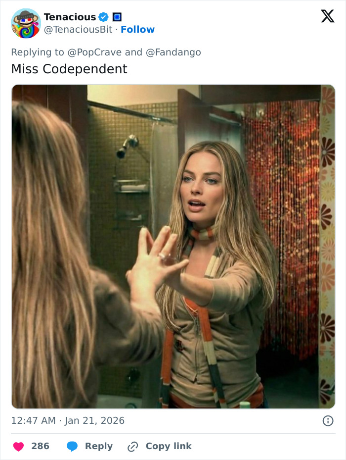 Margot Robbie on set wearing a scarf, looking into a mirror, related to her Wuthering Heights co-star Jacob Elordi rumors. Margot Robbie on set wearing a scarf, looking into a mirror, related to her Wuthering Heights co-star Jacob Elordi rumors.