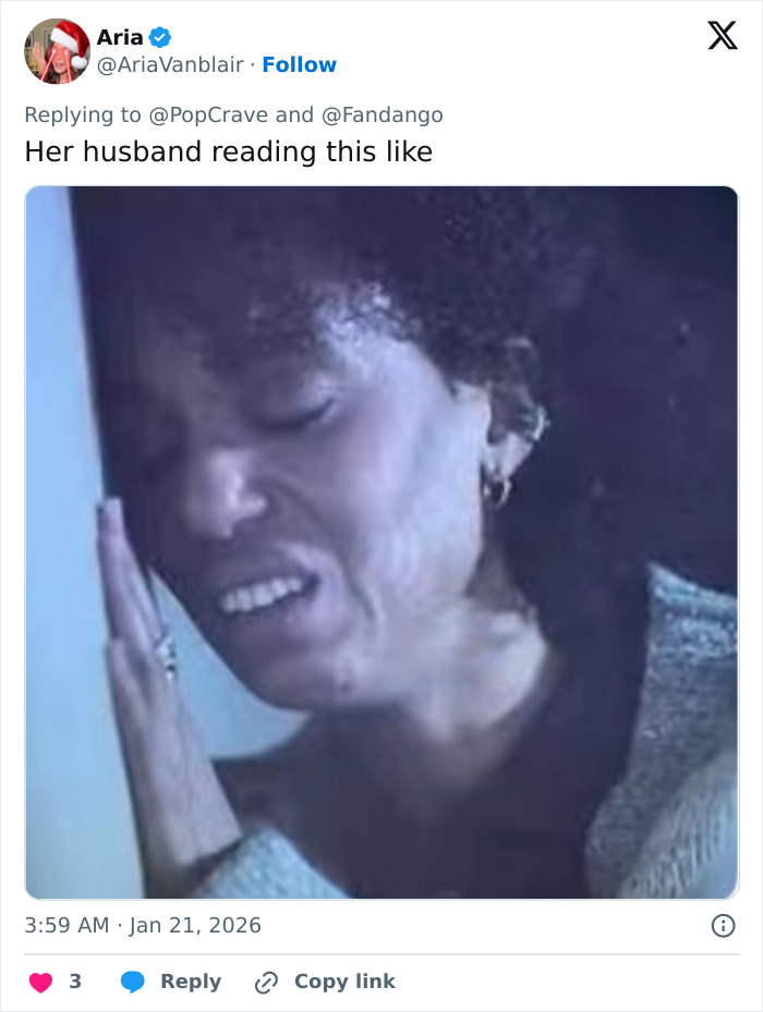 Woman leaning her face against a wall with a distressed expression, referencing Margot Robbie's on-set relationship rumors.