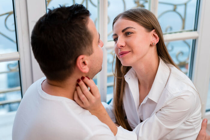 A doctor engaging in an unethical patient interaction, showing inappropriate close contact in a medical setting.