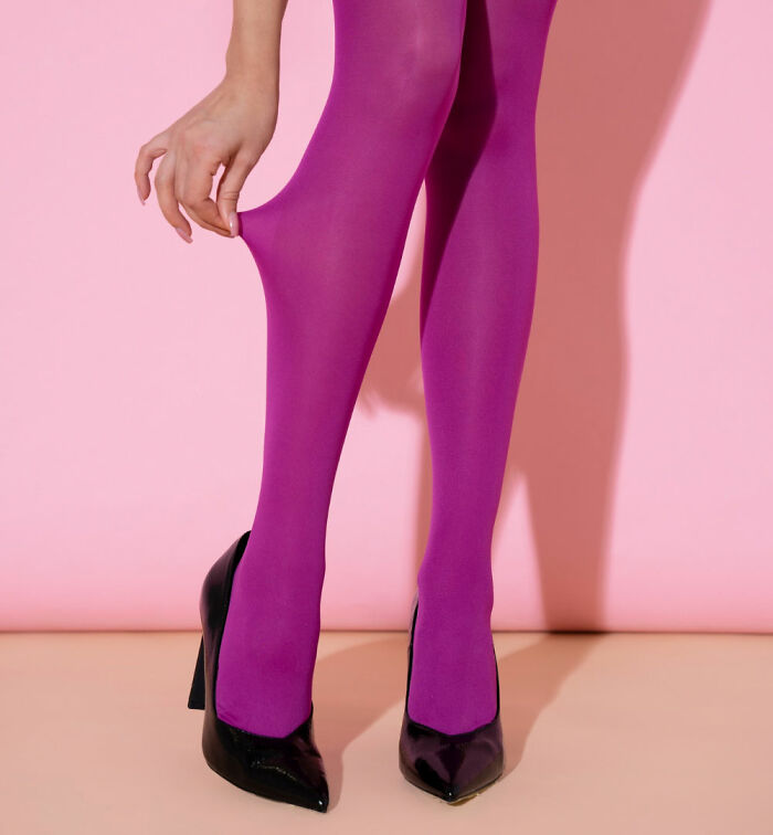 Close-up of legs wearing purple tights and black high heels, representing 3 AM chaos during the night shift work.