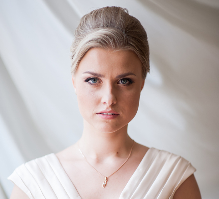 Bride in a white wedding dress looking serious, symbolizing drama after excluding sister-in-law from wedding photos Bride in a white wedding dress looking serious, symbolizing drama after excluding sister-in-law from wedding photos