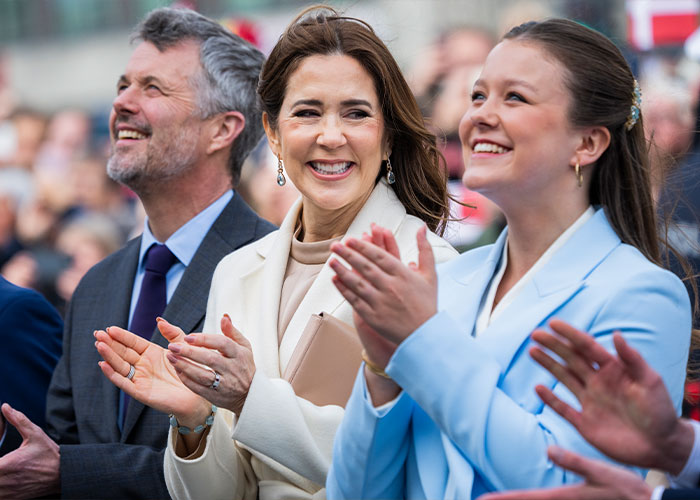 Smiling princess and attendees clapping at a public event related to Barron Trump and Princess Isabella marriage discussion. Smiling princess and attendees clapping at a public event related to Barron Trump and Princess Isabella marriage discussion.