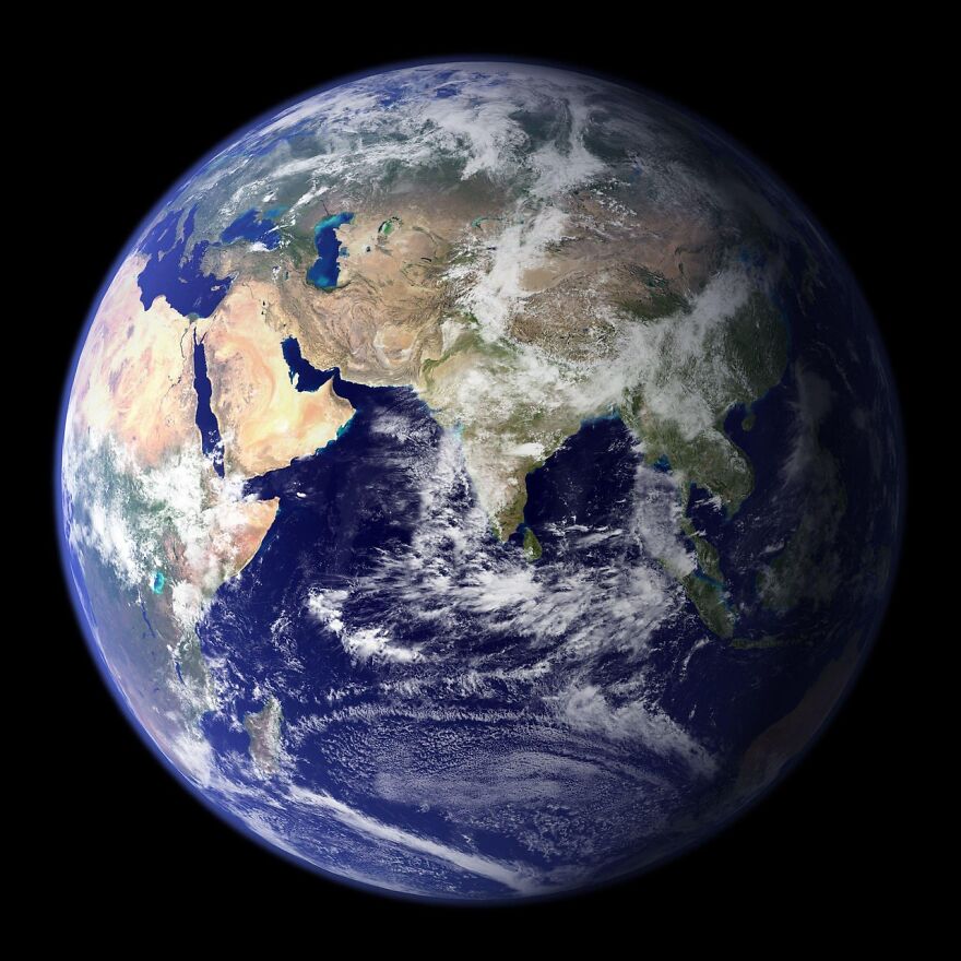 View of Earth from space showing continents and oceans with clouds, related to determining Earth costs and planet value.