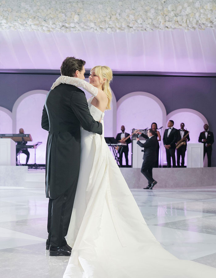 Bride and groom dancing at wedding with live band performing in the background during Brooklyn and Nicola’s celebration. Bride and groom dancing at wedding with live band performing in the background during Brooklyn and Nicola’s celebration.