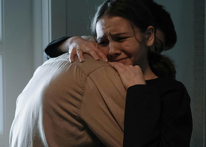 Woman demanding friend to kick husband out of romantic getaway, emotional and upset while hugging someone. Woman demanding friend to kick husband out of romantic getaway, emotional and upset while hugging someone.