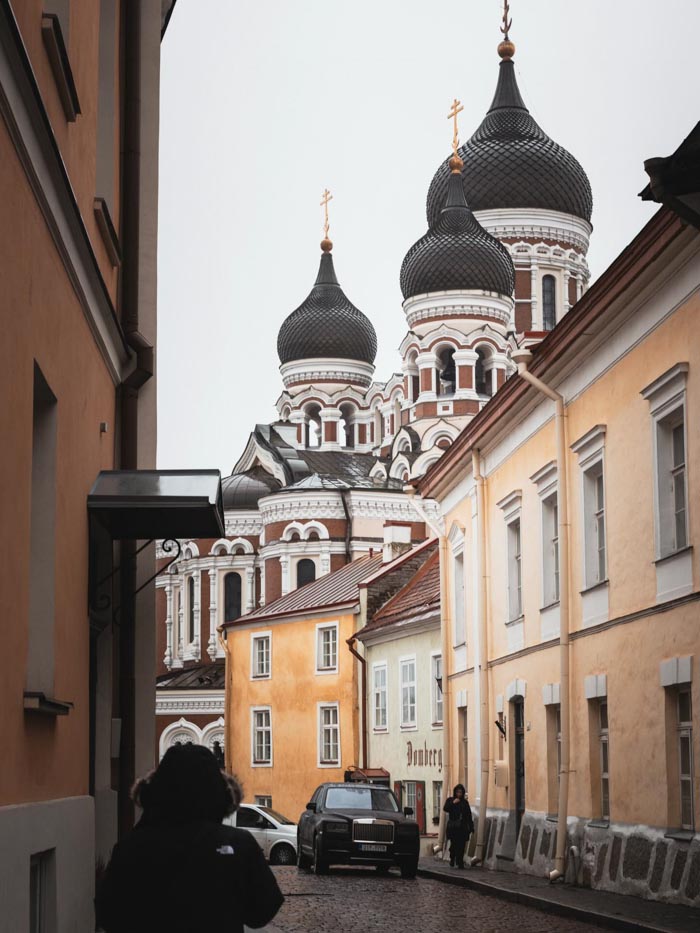 Street view in a European city with classic architecture, representing countries that sleep the most from OECD time use data.