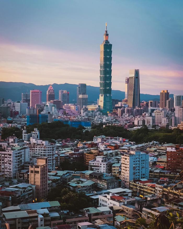 Taipei city skyline at sunset, representing countries that sleep the most according to OECD time use data.