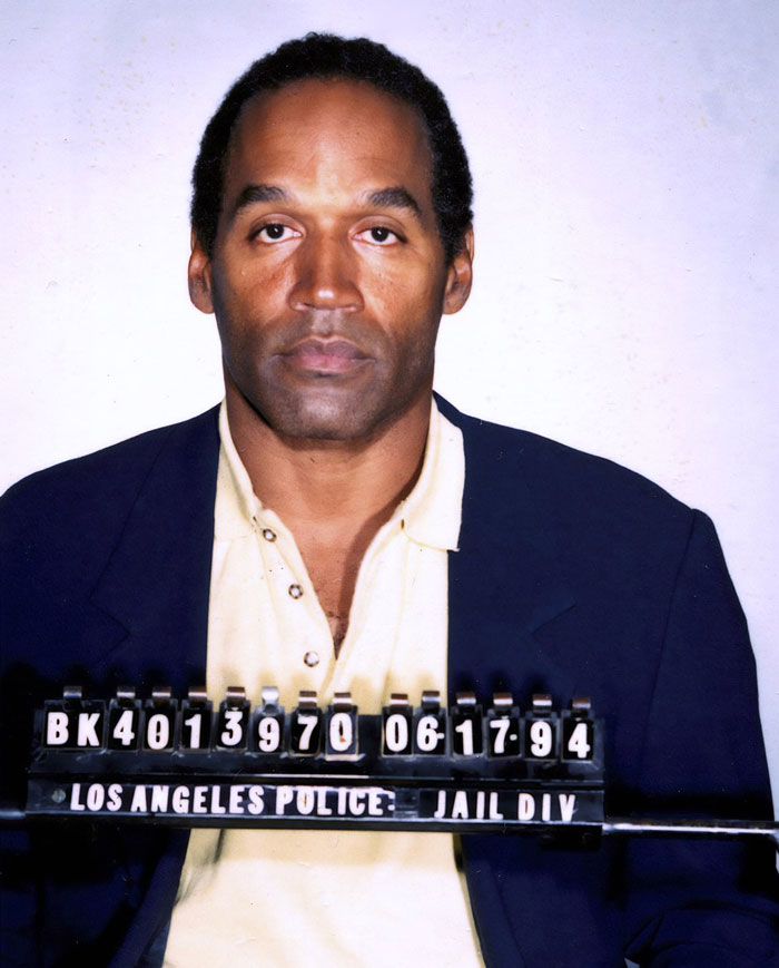Mugshot of a male celebrity taken by Los Angeles Police, illustrating a career crash and downfall in fame.